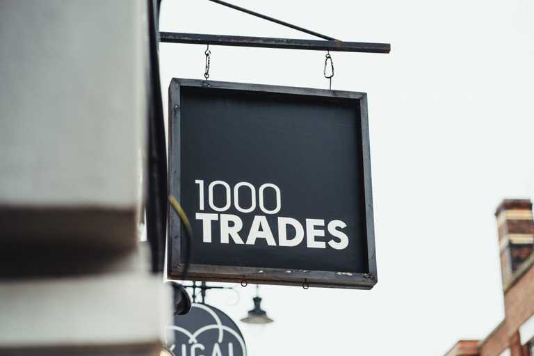 1000 Trades signage